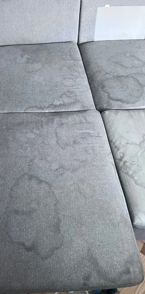 Canapé gris avant nettoyage